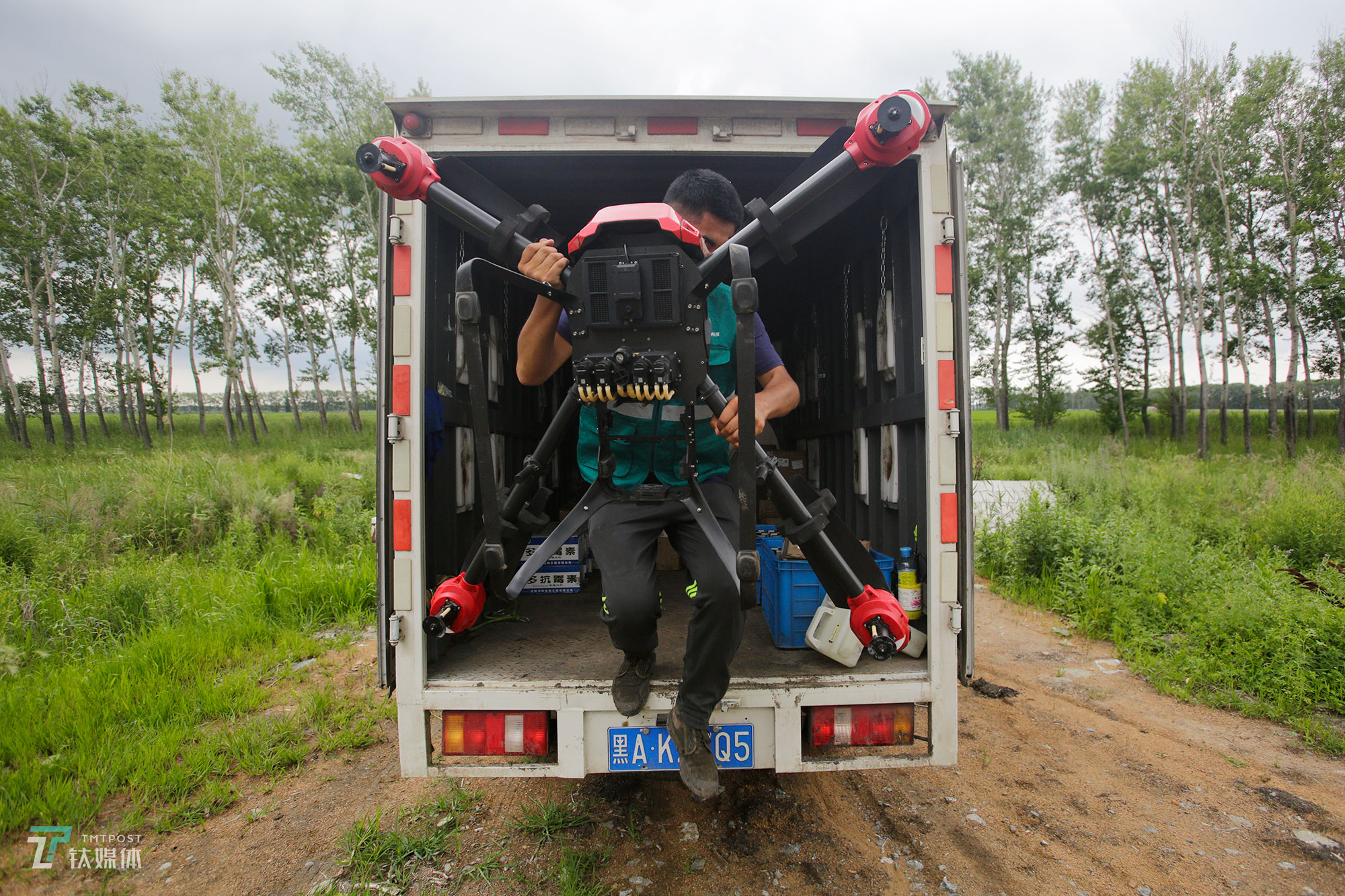 The new farmers with spraying drones in China's northeast farm land Beidahuang        