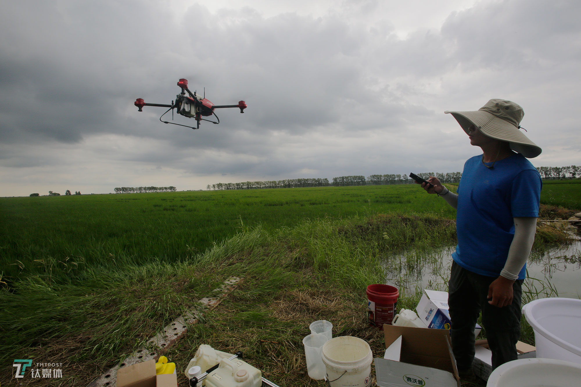 The new farmers with spraying drones in China's northeast farm land Beidahuang        