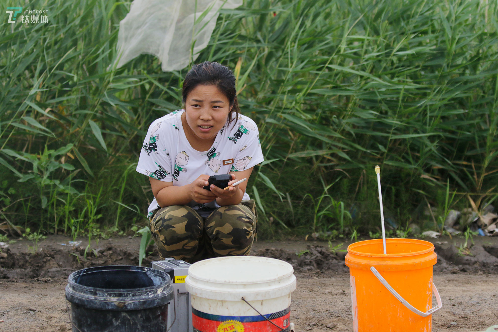 The new farmers with spraying drones in China's northeast farm land Beidahuang        