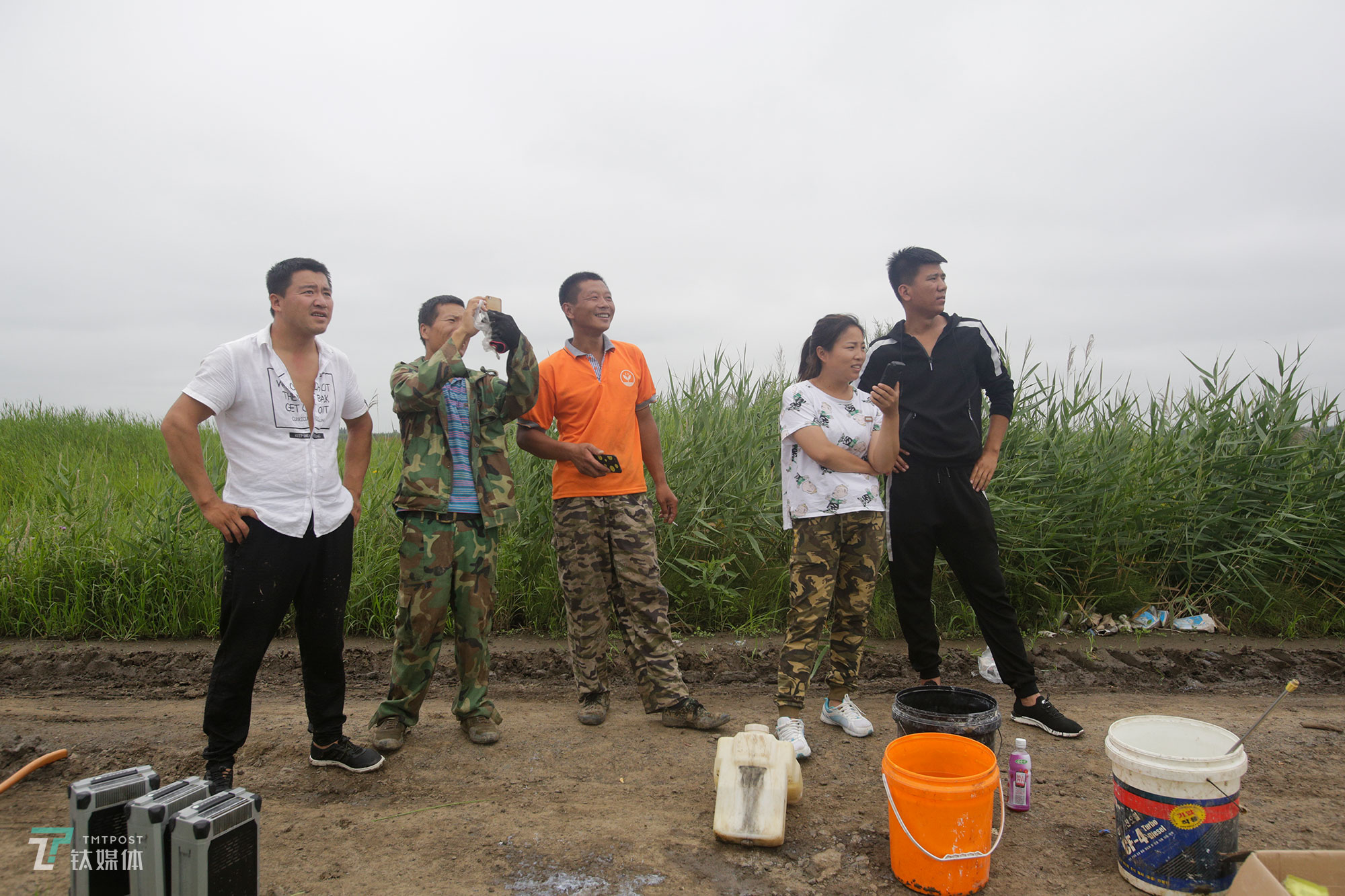 The new farmers with spraying drones in China's northeast farm land Beidahuang        