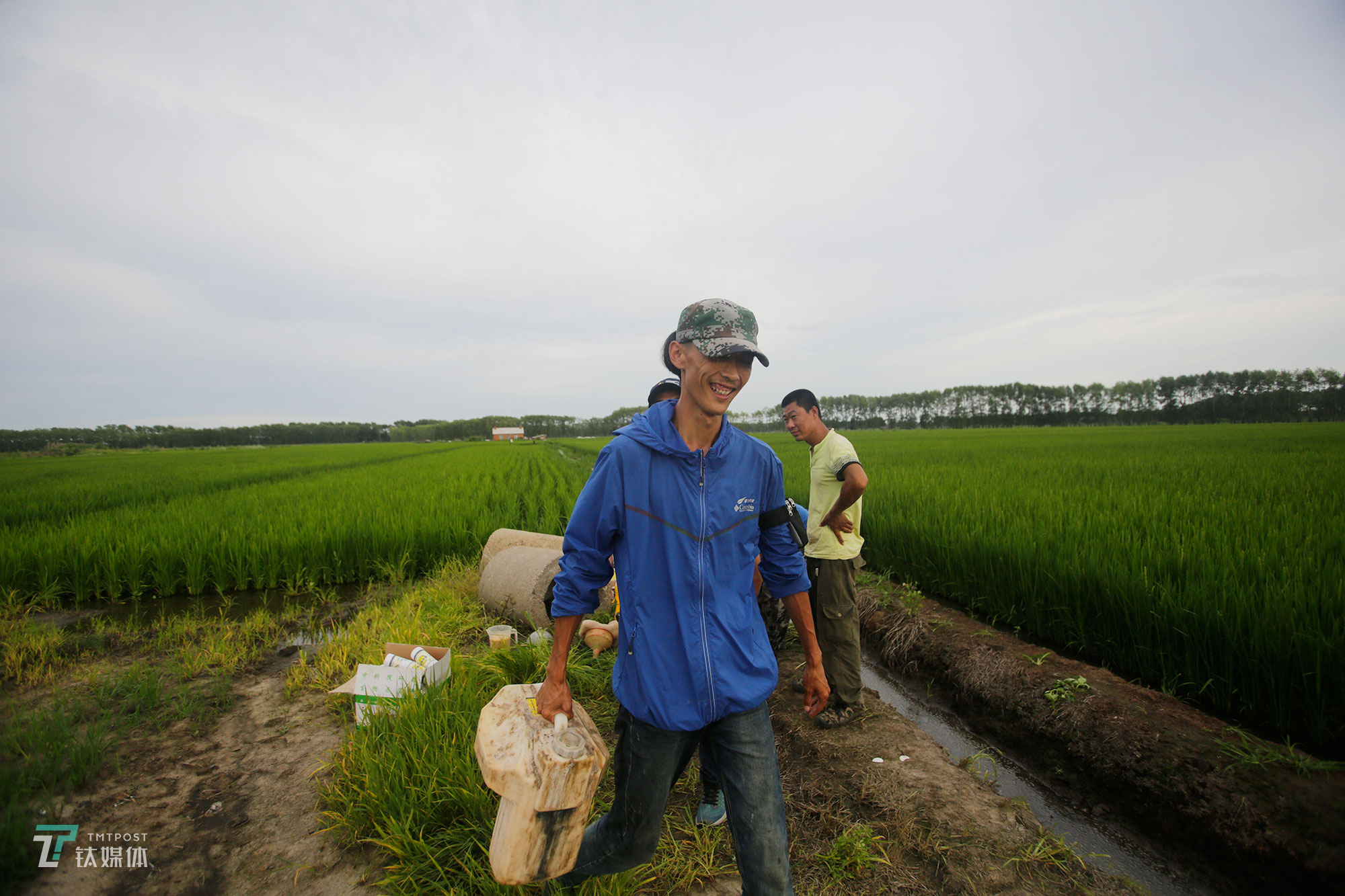The new farmers with spraying drones in China's northeast farm land Beidahuang        