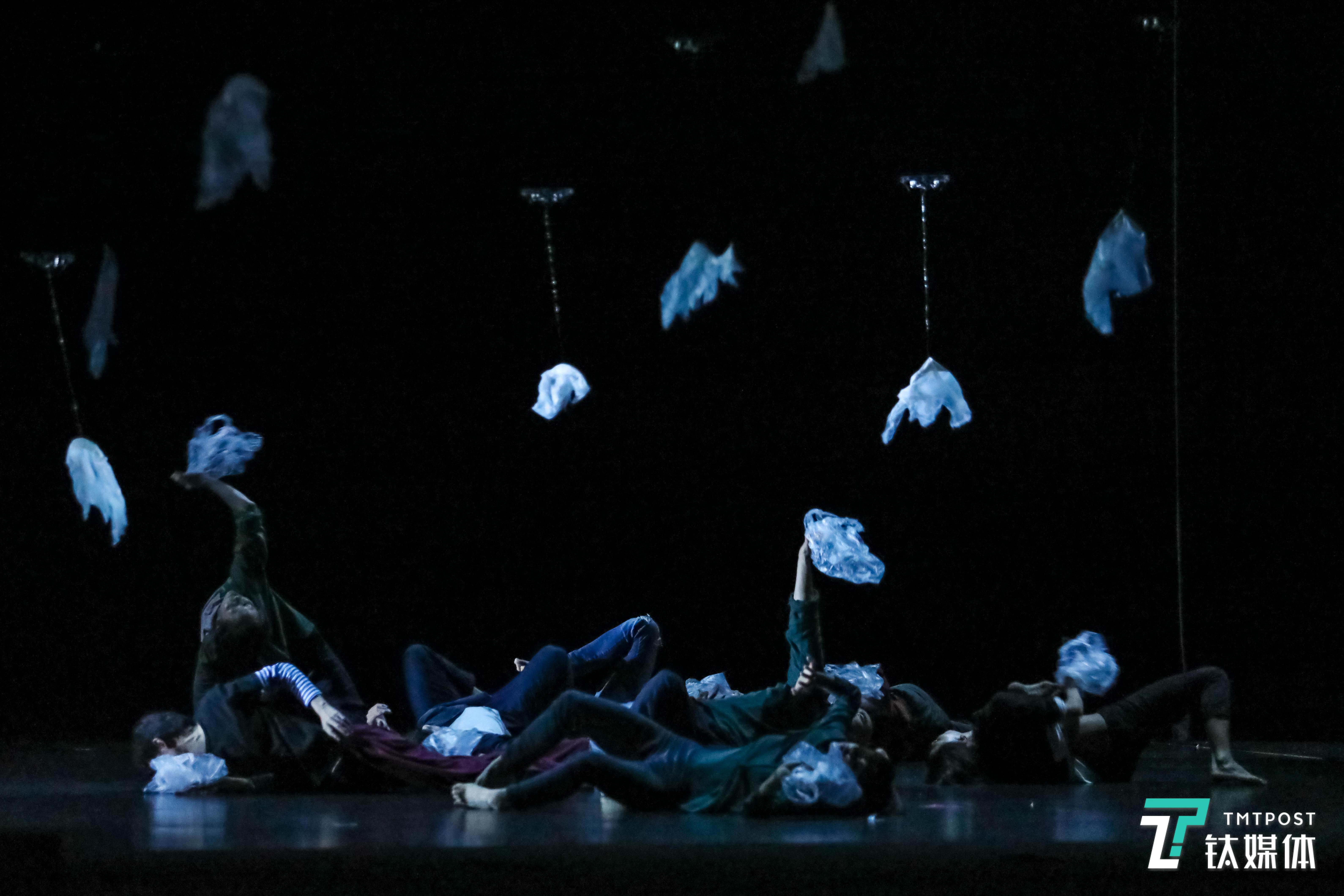 Dancers and plastic bags carried by drones