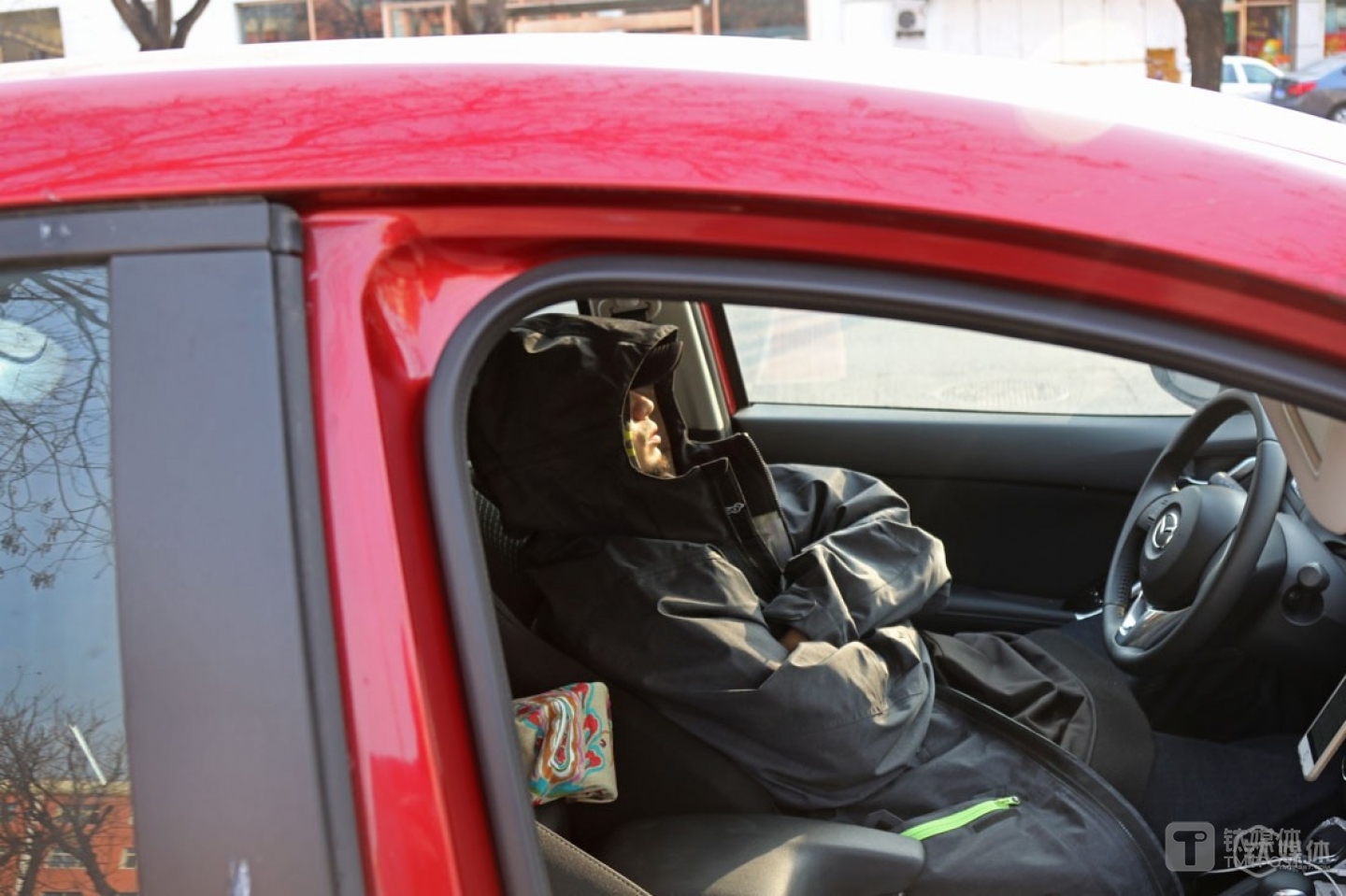 Since he stayed up too late last night, he got so exhausted on the way from the ski resort back to home that he had a rest in his car before be continued. Mr. Ball preferred to make himself feel comfortable, and would few get too exhausted from work.