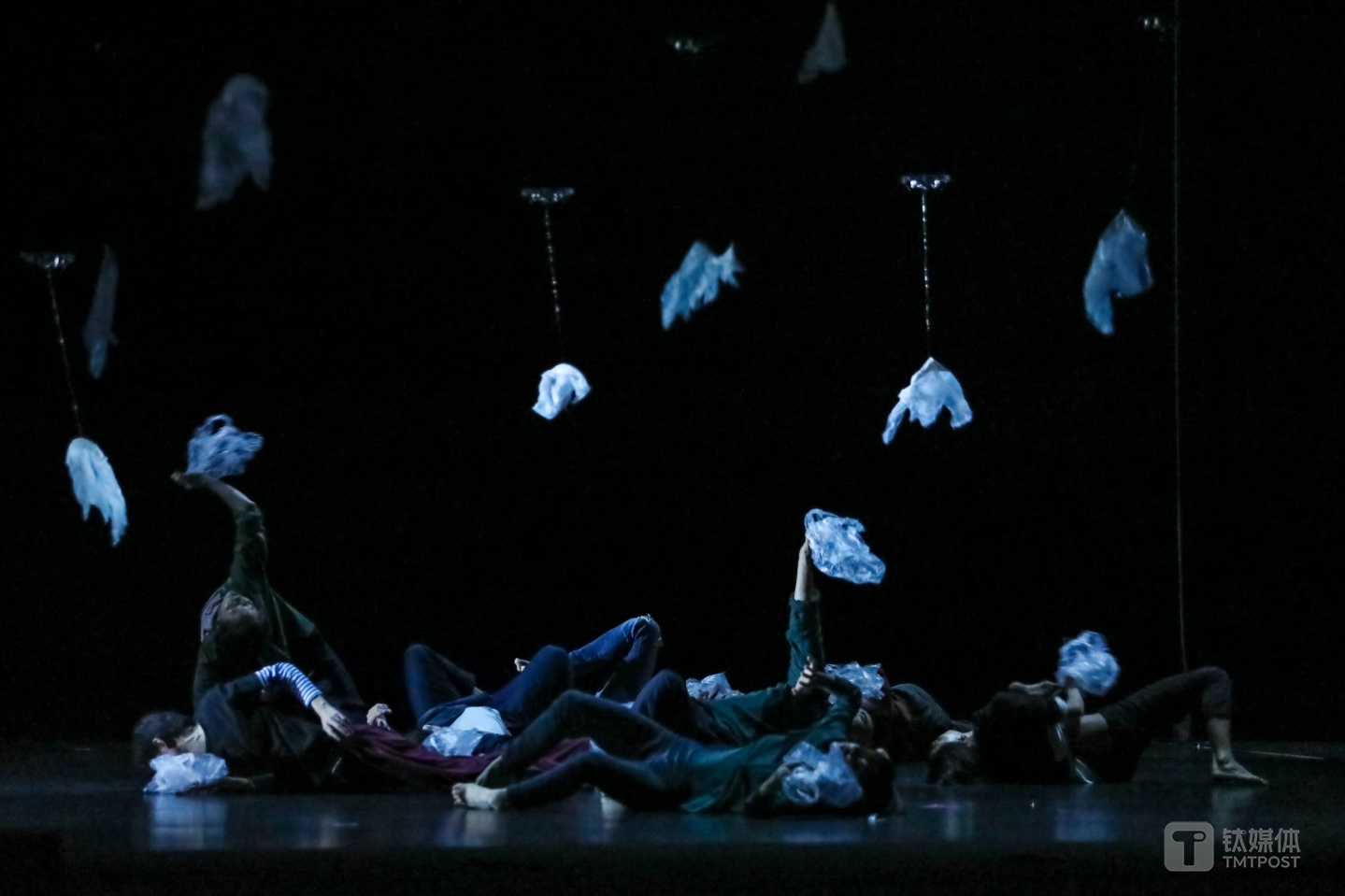 Dancers and plastic bags carried by drones