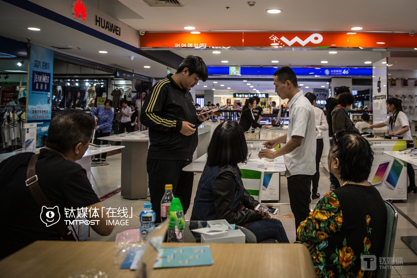 It was 6:40 PM. This family came to the store and bought an iPhone.